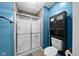 Updated bathroom featuring a shower with glass door and built-in storage at 11780 Pebblepointe Pass, Carmel, IN 46033