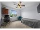 Bedroom with ample natural light, desk, and cozy armchair at 11780 Pebblepointe Pass, Carmel, IN 46033