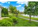 Backyard featuring lush landscaping, tranquil pond, and a walking path for outdoor enjoyment and relaxation at 127 Coatsville Dr, Westfield, IN 46074
