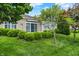 Picturesque backyard with manicured landscaping and a charming covered patio area, ideal for outdoor living at 127 Coatsville Dr, Westfield, IN 46074