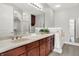 Bathroom featuring dual sinks, vanity, and a walk-in shower at 127 Coatsville Dr, Westfield, IN 46074