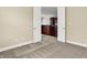 Bedroom features neutral carpet and an entrance to the kitchen at 127 Coatsville Dr, Westfield, IN 46074