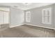 Bright bedroom with large windows with shutters and light-colored carpet at 127 Coatsville Dr, Westfield, IN 46074