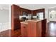 Well-equipped kitchen featuring dark wood cabinets, stainless steel appliances, and granite countertops at 127 Coatsville Dr, Westfield, IN 46074