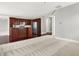 Bright and open living room area with dark wood floors that opens into the kitchen area at 127 Coatsville Dr, Westfield, IN 46074