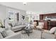 Open-concept living room features stylish furniture, modern decor, and flows into the kitchen at 127 Coatsville Dr, Westfield, IN 46074