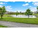 Scenic pond view surrounded by lush greenery and beautiful homes in a serene community at 127 Coatsville Dr, Westfield, IN 46074