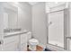 Bathroom featuring modern vanity, toilet, and a glass-enclosed shower at 14226 Frostburg Dr, Carmel, IN 46033