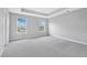 Bright bedroom with carpet floors featuring windows overlooking the front yard at 14226 Frostburg Dr, Carmel, IN 46033