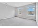 Bedroom with neutral walls, carpeted floors, and two windows providing ample natural light at 14226 Frostburg Dr, Carmel, IN 46033