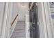 View of the entryway featuring a staircase, light fixture and a dark front door at 14226 Frostburg Dr, Carmel, IN 46033