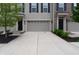 Exterior showcasing garages, driveways, and meticulous landscaping at 14226 Frostburg Dr, Carmel, IN 46033
