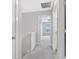 Hallway with neutral walls and carpeted floors offers a seamless transition between rooms at 14226 Frostburg Dr, Carmel, IN 46033