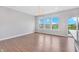 Bright living room with wood floors, large windows and a glass sliding door at 14226 Frostburg Dr, Carmel, IN 46033