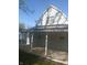 Charming home exterior with a covered back porch, perfect for relaxing and enjoying the outdoors at 1433 Charles St, Indianapolis, IN 46225