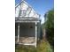 Charming home exterior with a covered back porch, providing a welcoming entrance and outdoor living space at 1433 Charles St, Indianapolis, IN 46225