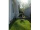 Side of the property showcasing siding, grass, storage and an AC unit at 1433 Charles St, Indianapolis, IN 46225
