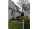 Backyard showcasing the siding, a well-kept lawn, and storage garage at 1433 Charles St, Indianapolis, IN 46225