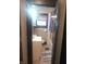 Bathroom with a white vanity, toilet, and shower/tub combination at 1433 Charles St, Indianapolis, IN 46225