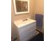 Bathroom featuring white single sink vanity with drawers, a towel bar, and a mirror at 1433 Charles St, Indianapolis, IN 46225