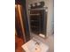 A bathroom with a sink and vanity, framed mirror, and lights above the mirror at 1433 Charles St, Indianapolis, IN 46225