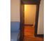 Bedroom showcasing an open closet with black trim, blue chair, and wood floors at 1433 Charles St, Indianapolis, IN 46225