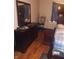 Bedroom featuring a dresser with a large mirror, wooden floors, and a bed at 1433 Charles St, Indianapolis, IN 46225