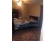 Bedroom featuring a queen-sized bed, dresser, and vintage ceiling fan at 1433 Charles St, Indianapolis, IN 46225