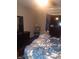 Bedroom featuring a bed, dresser, and a vintage fan at 1433 Charles St, Indianapolis, IN 46225