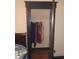 Bedroom showcasing an open closet with clothes and black trim at 1433 Charles St, Indianapolis, IN 46225