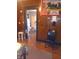 Dining room featuring a doorway, wood-paneled walls, and patriotic decor at 1433 Charles St, Indianapolis, IN 46225