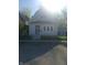 Charming two-story home featuring vinyl siding, well-maintained lawn, and a secure chain-link fence at 1433 Charles St, Indianapolis, IN 46225