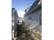Home exterior featuring a detached garage and covered porch area at 1433 Charles St, Indianapolis, IN 46225