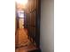 Hallway featuring hardwood floors, an area rug, and classic dark wood trim at 1433 Charles St, Indianapolis, IN 46225