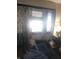 Bright living room featuring a window with curtains and a comfortable sofa at 1433 Charles St, Indianapolis, IN 46225