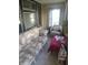 Cozy sunroom with comfortable seating, natural light, and a tranquil atmosphere at 1433 Charles St, Indianapolis, IN 46225