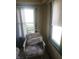 Bright sunroom featuring windows and comfortable seating, offering a relaxing space to enjoy the natural light at 1433 Charles St, Indianapolis, IN 46225
