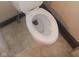 An up-close shot of a standard toilet with a white seat and lid at 1433 Charles St, Indianapolis, IN 46225
