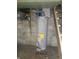 Standard water heater with visible connections, situated in the basement at 1433 Charles St, Indianapolis, IN 46225
