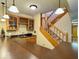 Basement bar area with cabinets, a staircase, and pendant lighting at 1544 Olive Branch Cir, Greenwood, IN 46143