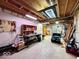 Unfinished basement with exposed ceiling, workbench, and ample storage at 1544 Olive Branch Cir, Greenwood, IN 46143