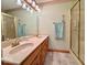 Bathroom featuring double sinks, wood cabinets, and a separate shower at 1544 Olive Branch Cir, Greenwood, IN 46143