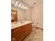Traditional bathroom with a wood vanity, toilet, and sink at 1544 Olive Branch Cir, Greenwood, IN 46143