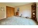 Cozy bedroom with corner shelving, natural light, and wooden accents at 1544 Olive Branch Cir, Greenwood, IN 46143