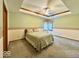Comfortable bedroom featuring a tray ceiling, a bed, and neutral-toned walls at 1544 Olive Branch Cir, Greenwood, IN 46143