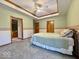 Comfortable bedroom featuring a tray ceiling, a bed, and neutral-toned walls at 1544 Olive Branch Cir, Greenwood, IN 46143