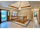 Spacious entryway features ceramic tile flooring, half-lite door, wooden banister, and decorative ceiling with chandelier at 1544 Olive Branch Cir, Greenwood, IN 46143