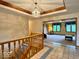 Grand foyer with tiled floors and staircase leading to the living space at 1544 Olive Branch Cir, Greenwood, IN 46143