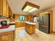 Spacious kitchen features modern stainless appliances, a kitchen island, and plenty of counter space at 1544 Olive Branch Cir, Greenwood, IN 46143
