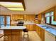 Large kitchen features wooden cabinets, a center island, and modern appliances at 1544 Olive Branch Cir, Greenwood, IN 46143